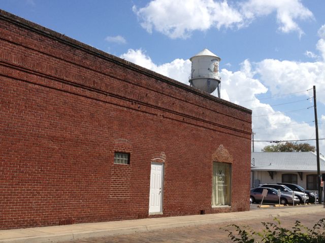 bricks, sky, and small-town water tower are very....small-town like small town
