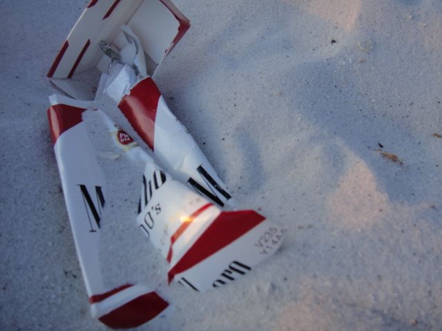 Trashed Marlboro box in the sand