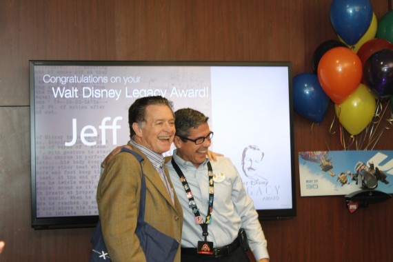 Lee Cockerell presenting jeff noel with the first copy of The Customer Rules