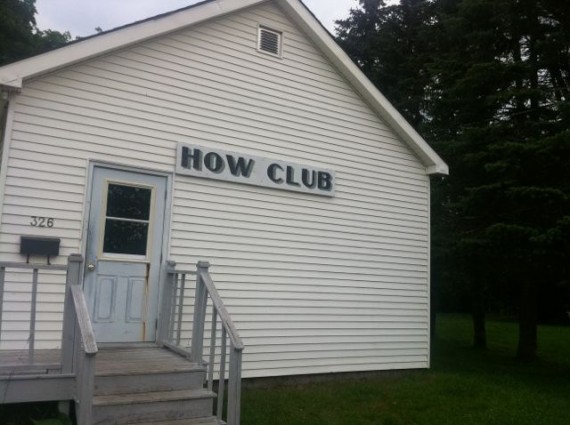 Small white building called How Club