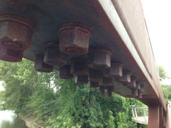 Steel bridge girders with massive nuts and bolts