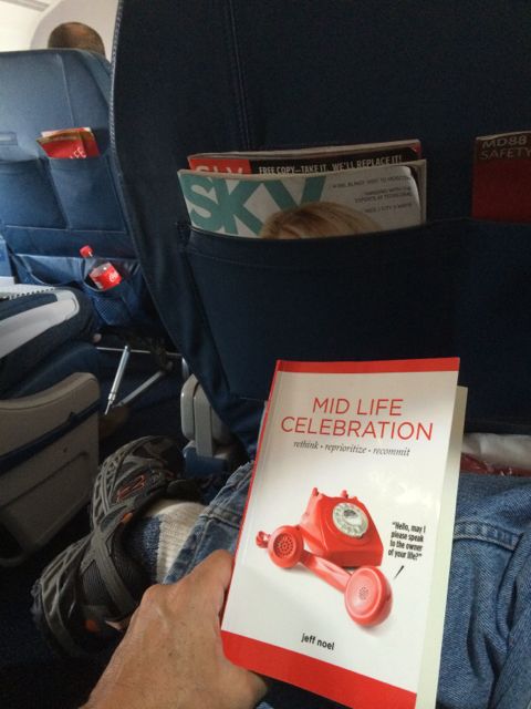 Mid Life Celebration book in Delta first class cabin