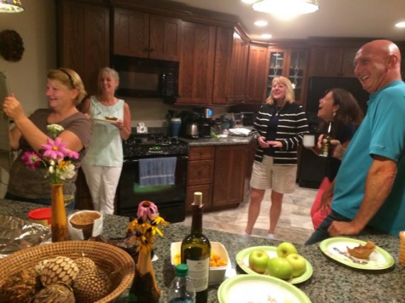 Middle-aged adults have fun on a Labor Day weekend reunion in a mountain cabin