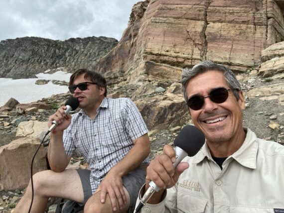Jody Maberry and jeff noel podcasting by a glacier