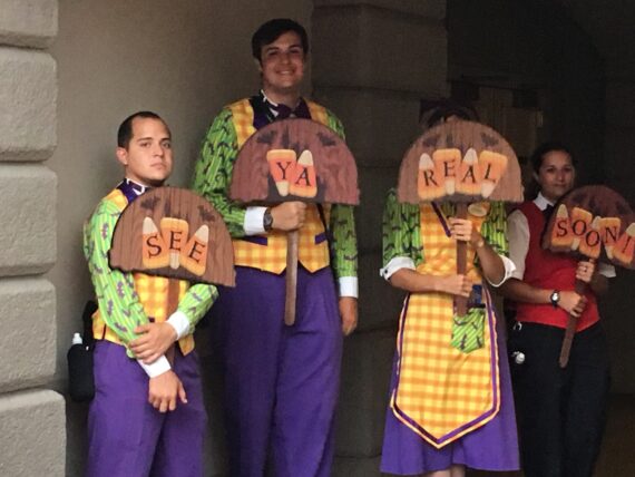 Four Cast Members in Halloween themed Cast Member costumes