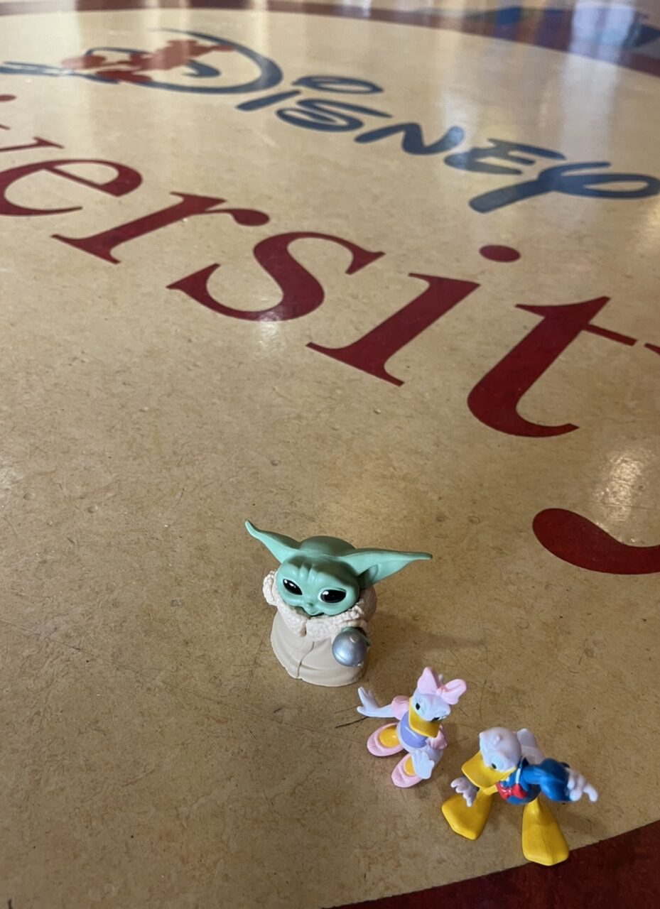 Disney toy characters on floor of Disney University