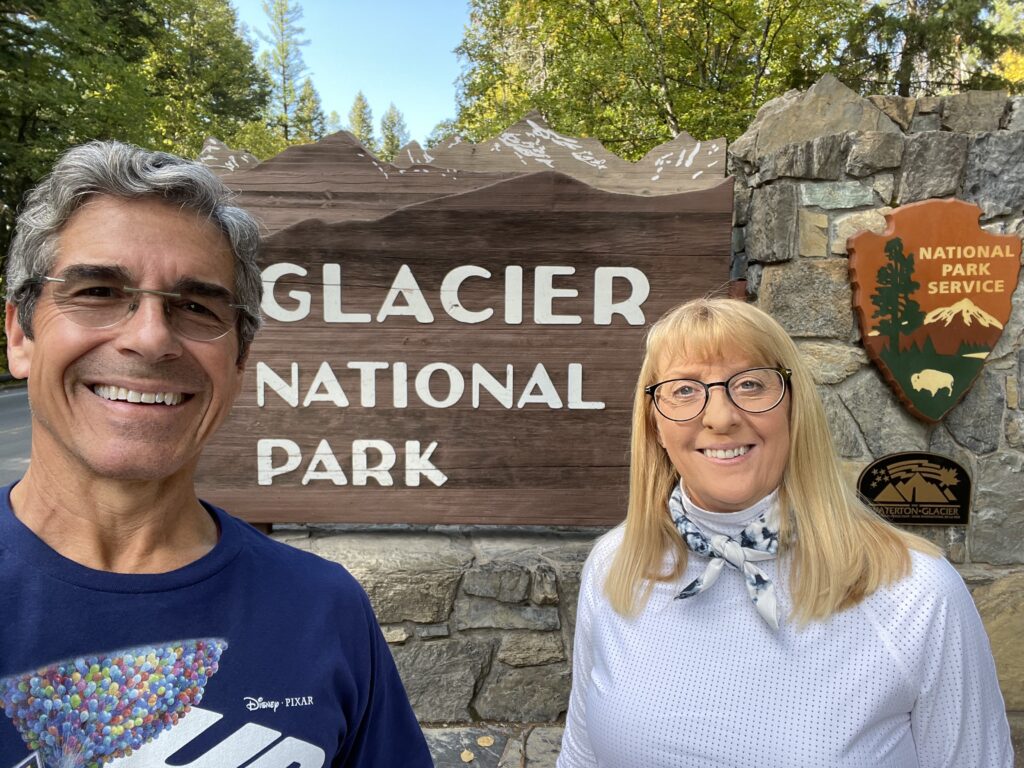 Couple in front of Park sign