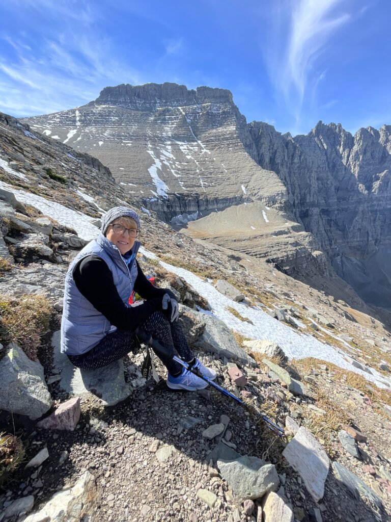 woman sitting on mountain