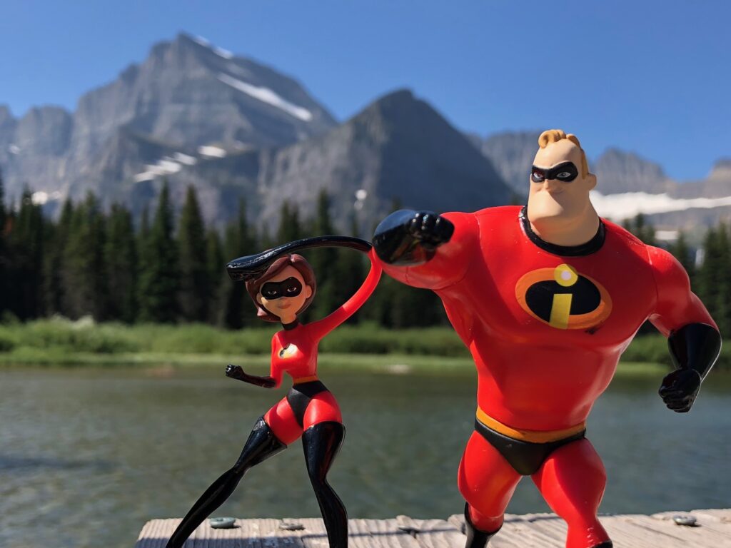Mr and Mrs Incredible plastic toys in mountains