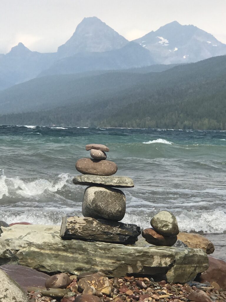 rock sculpture pile at mountain lake