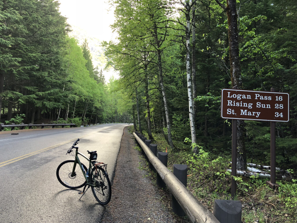 lone bicycle parked on mountain road