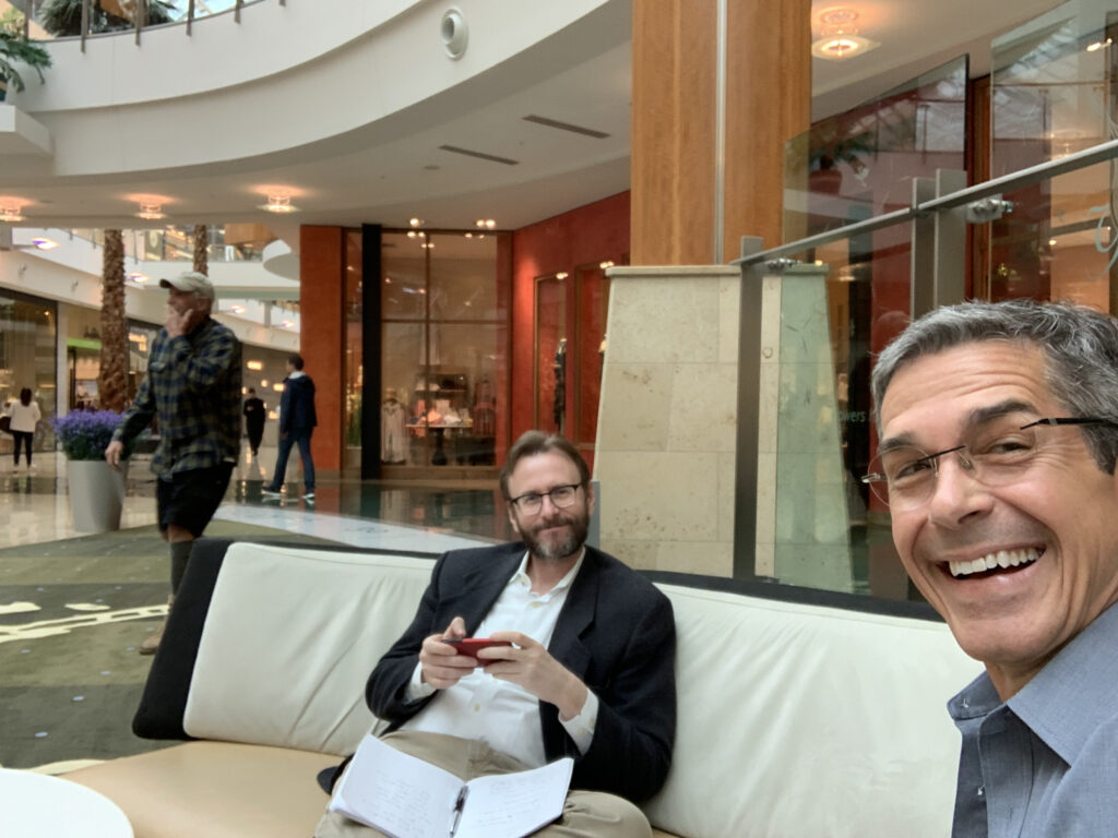 two men sitting in a fancy Mall