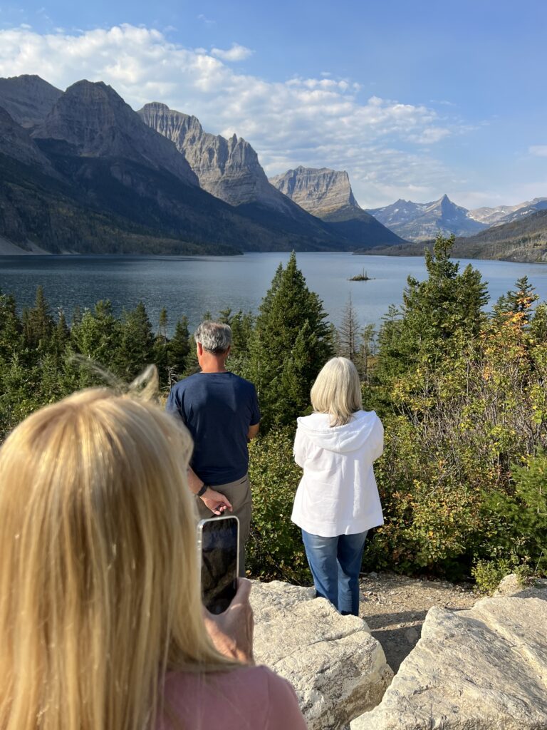 Three people at a Mountain Lake