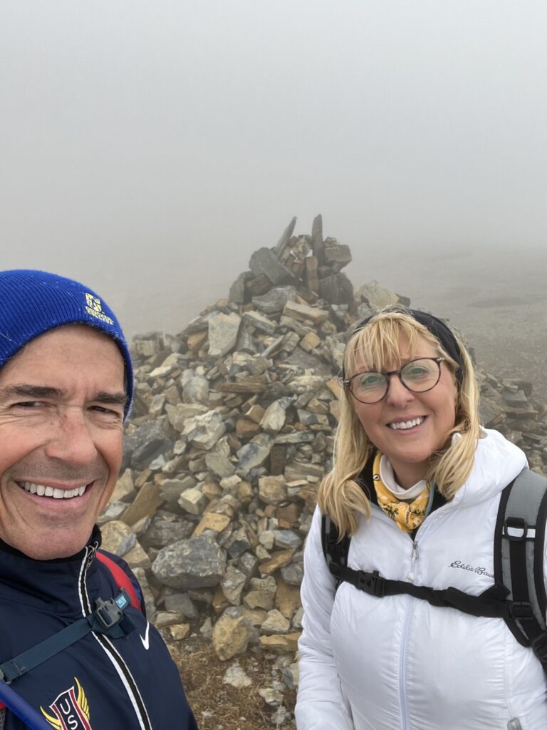 Couple posing by rock pile