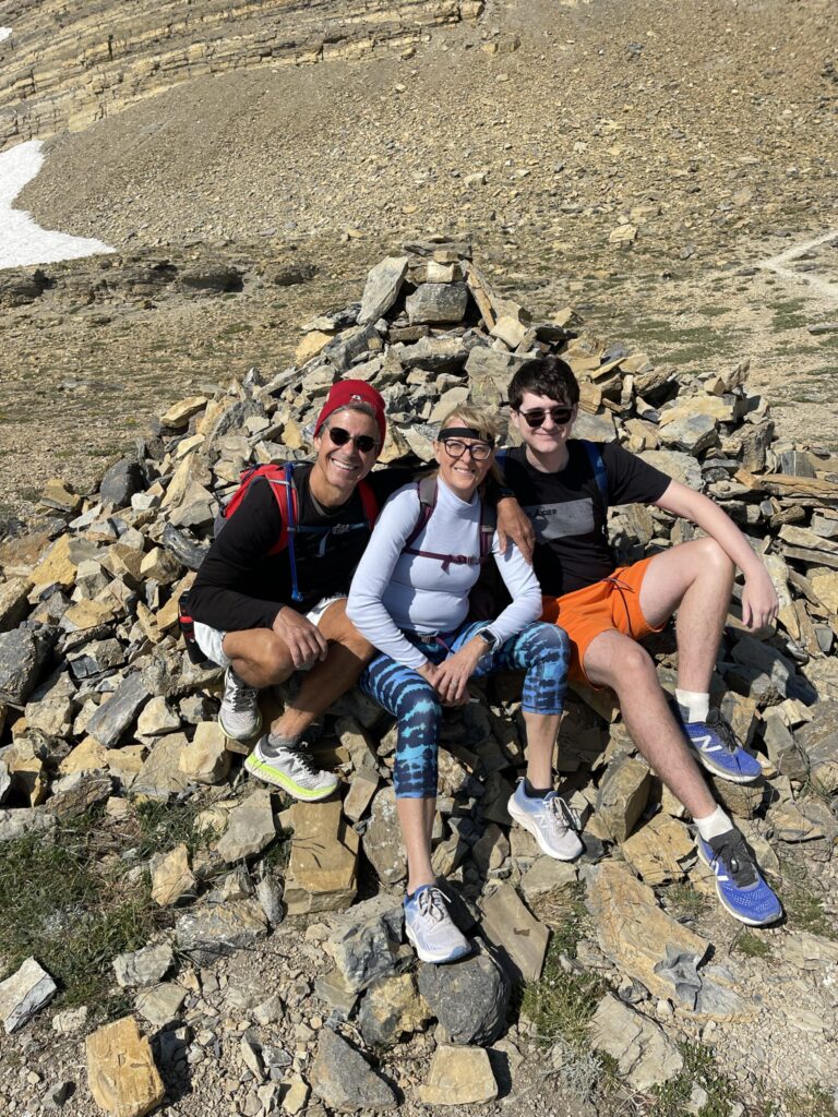 Family posing by Rock pile